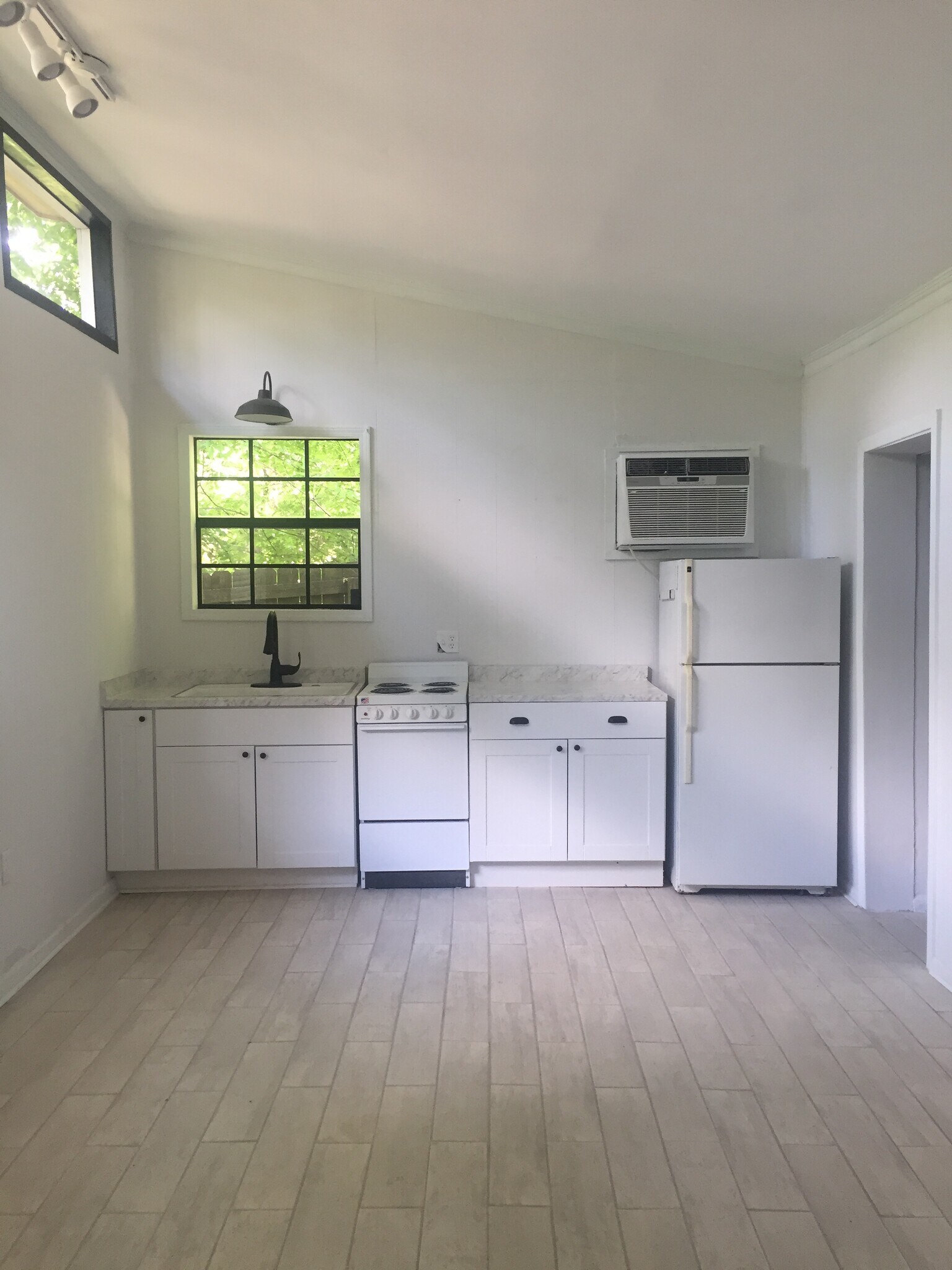 East end of the unit featuring kitchenette and bathroom/closet door on right - 1742 N Parkway