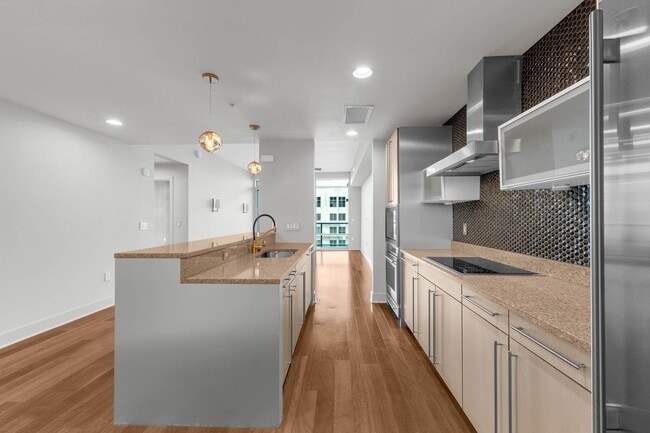Building Photo - “Sleek Design Meets Walkable Downtown Livi...