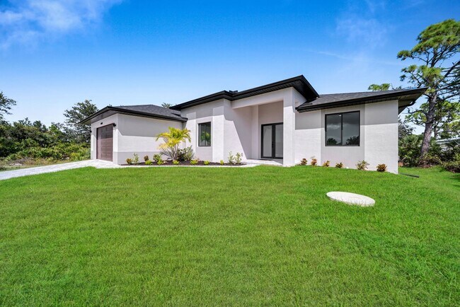 Building Photo - Single family for rent in Port Charlotte. New construction. 3+Den/ 2 bath. City water.