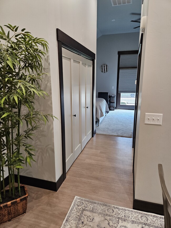 Hallway from kitchen/dining to living/Bedroom. Closet is large w/built-in shelving - 1122 Stoneridge Dr