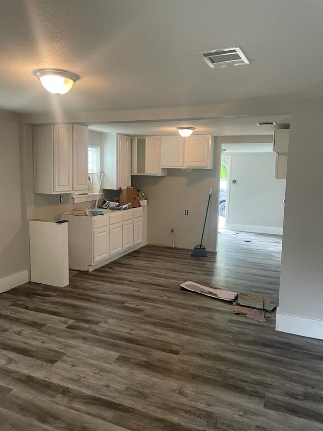 Kitchen in rehab stage waiting for granite counters and stove and appliances. - 102 22nd St N