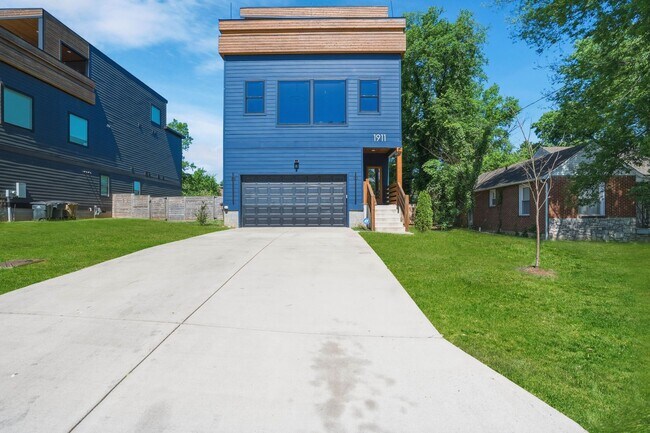 Building Photo - Luxury Nashville Retreat with Skyline & River Views | 4BR + Rooftop Entertainment Loft