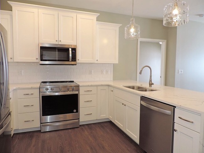 Building Photo - LUXURY CONDO - AVAILABLE NOW - MOVE IN PROMO