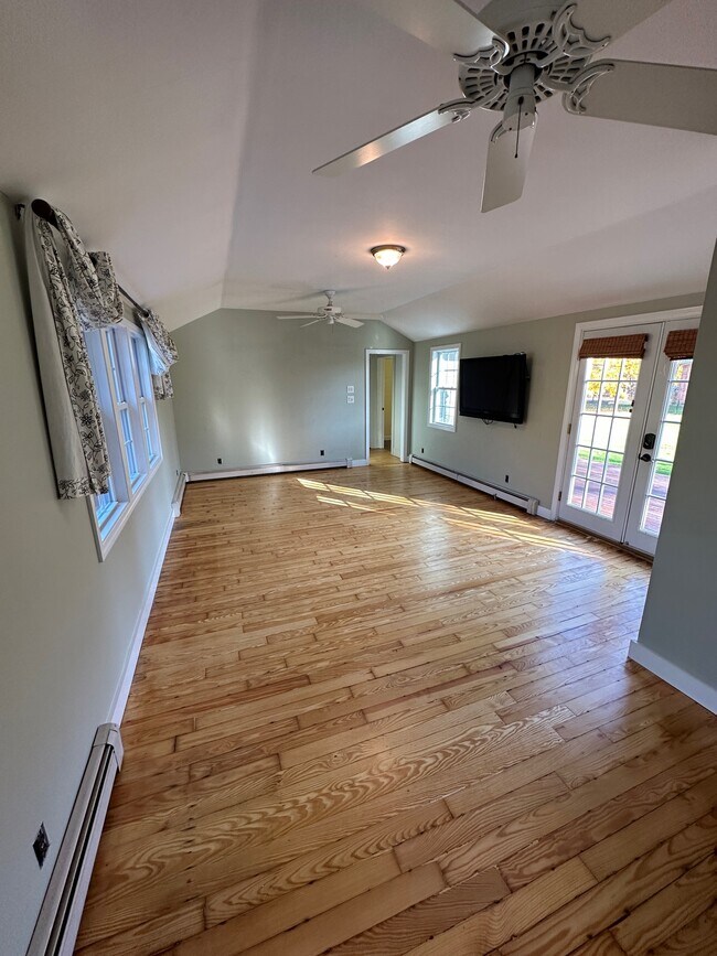 Living room with hallway and downstairs bedroom beyond - 480 Newington Rd