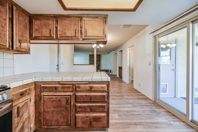 Building Photo - 3 bedroom, 2 bath with large living room and brick fireplace.  Good size kitchen with tons of cab...