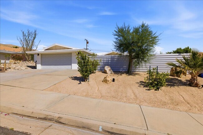 Building Photo - 3 bed / 2 Bath Mid-Century Home with Two-Car Garage, Soaking Pool and Manicured Backyard!
