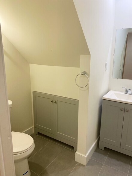 Half bath with new amenities and additional storage - 3 Alton Rd