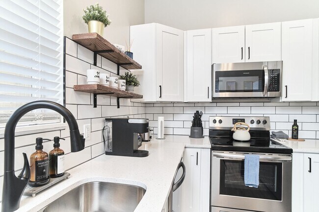 Building Photo - Fully Furnished 2BD Duplex in the Heart of...