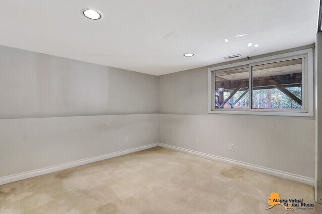 Building Photo - Eagle River Home w/ Fenced Yard, Sunroom, and Garage!