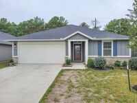 Building Photo - BEAUTIFUL 3 BEDROOM 2 BATH HOME WITH NO BACKYARD NEIGHBORS. TALL TREES AS YOU LOOK FROM THE COVER...