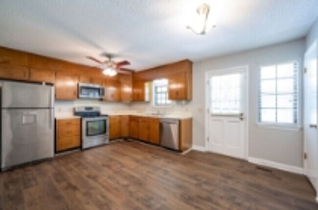 Building Photo - This beautifully updated brick home in Har...