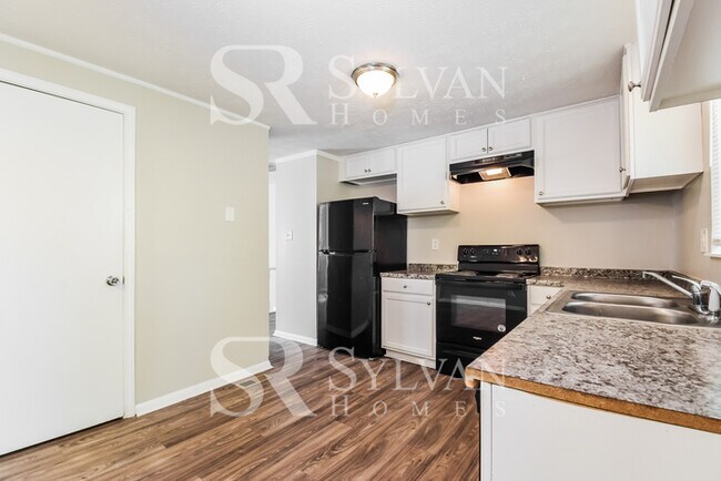 Building Photo - The living is easy in this 4 bedroom, 2 ba...