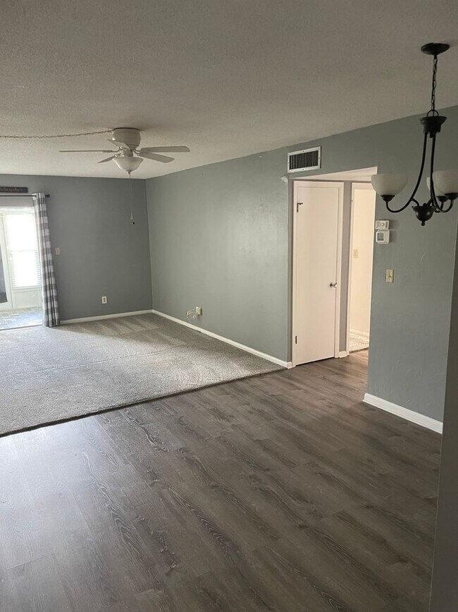 Building Photo - 55+ Charming first-floor condo nestled in ...