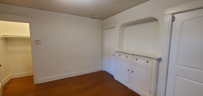 The bedroom closet stretches the length of the back wall - 1229 N Orange Grove Ave