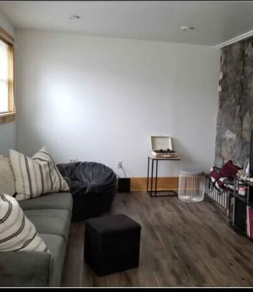 Living Room with Stone Wall - 336 N 10th St