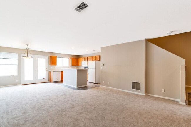 Building Photo - 3BR Townhome Near DIA & Light Rail | New Carpet, Garage & Fenced Patio