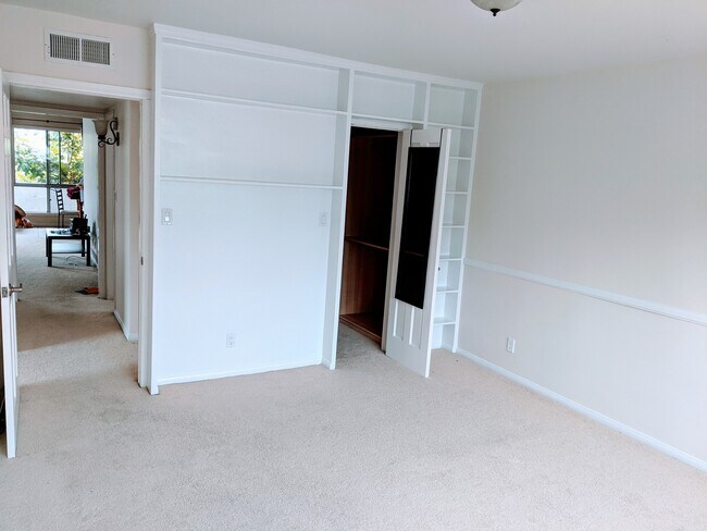 Guest Bedroom Shelves and Walk-in Closet - 10445 Eastborne Ave