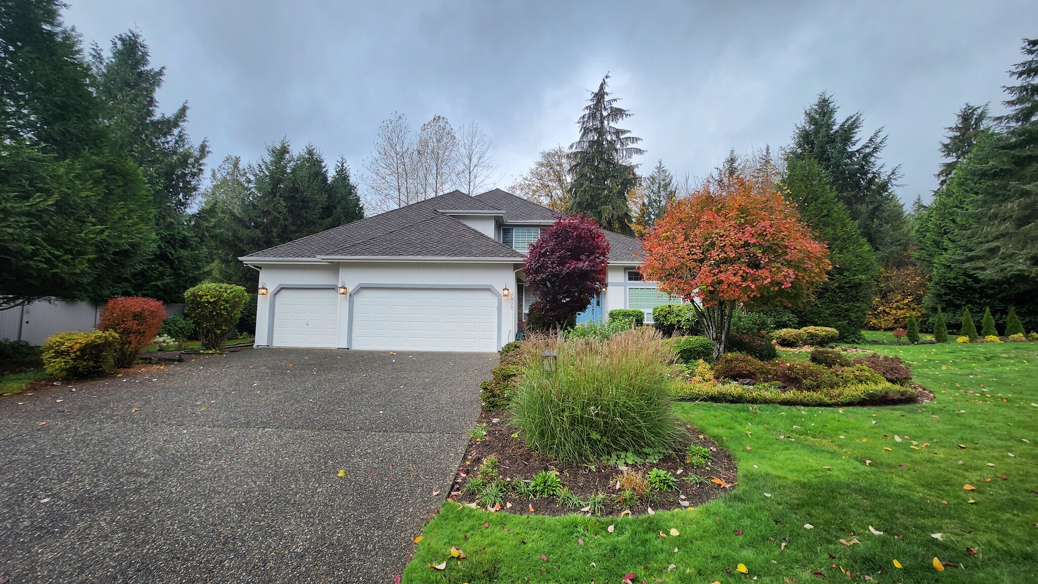 In addition to 3 car garage there is ample parking and space in driveway - 7409 245th Way NE