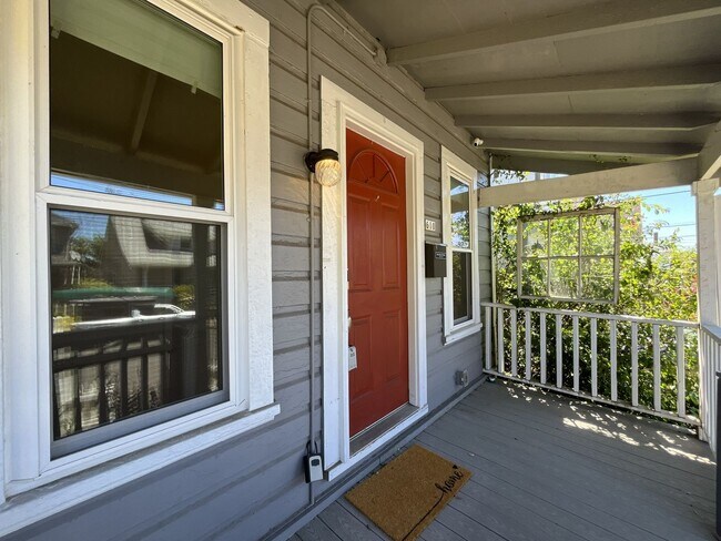 Building Photo - Charming Cottage with Hardwood Flooring, Modern Kitchen & Beautiful Outdoor Living Areas