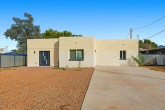 Building Photo - Bright, Fresh & Pet-Friendly — 3BR Retreat Minutes from U of A