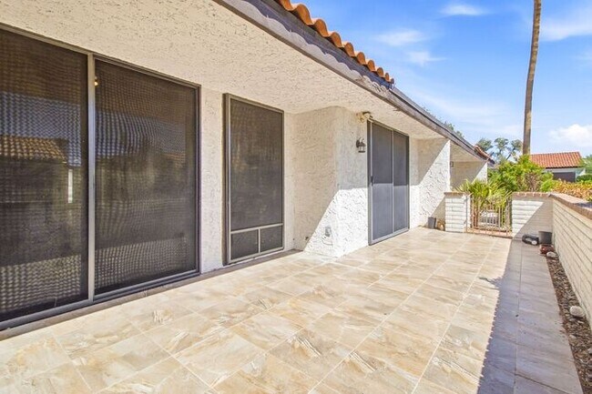 Building Photo - Gated 3-Bedroom Townhome with Fireplace, Patio & 2-Car Garage