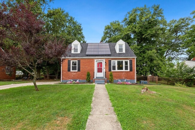 Building Photo - Move-In Ready Cape Cod with 3 Finished Levels & Huge Backyard