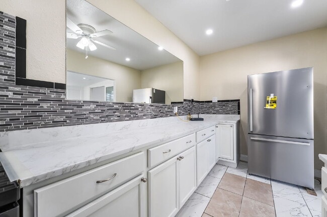 Building Photo - Single Story,  Totally Renovated , 3 bedroom, 2 bathroom Home with  extensive privacy and gated h...