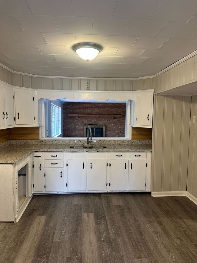 Building Photo - Spacious 3BR/2BA with Cozy Fireplace & Bright Living