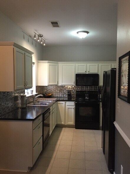 Kitchen photo isn't update. Backslash is white subway tiles. - 4101 Woodbury Terrace NW