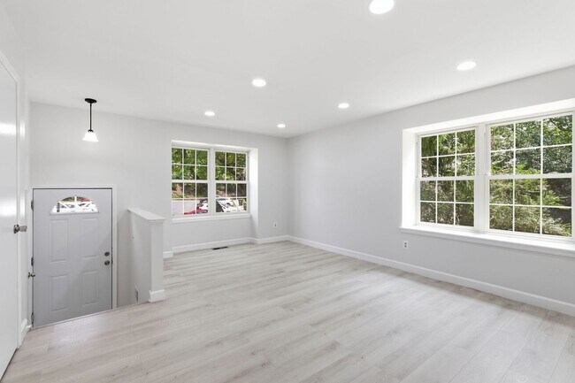 Building Photo - Experience contemporary living in this beautifully renovated residence where modern design meets ...
