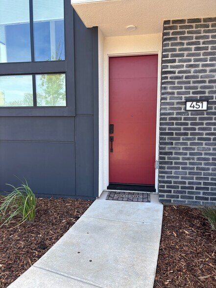 Front door to newly constructed tri-level home with roof patio - 451 Dowitcher Walk