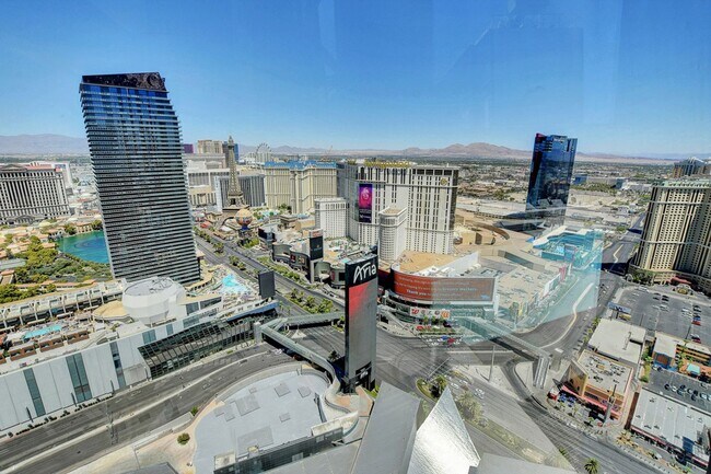 Building Photo - Stunning Strip Views from this Fully Furnished Studio Residence.