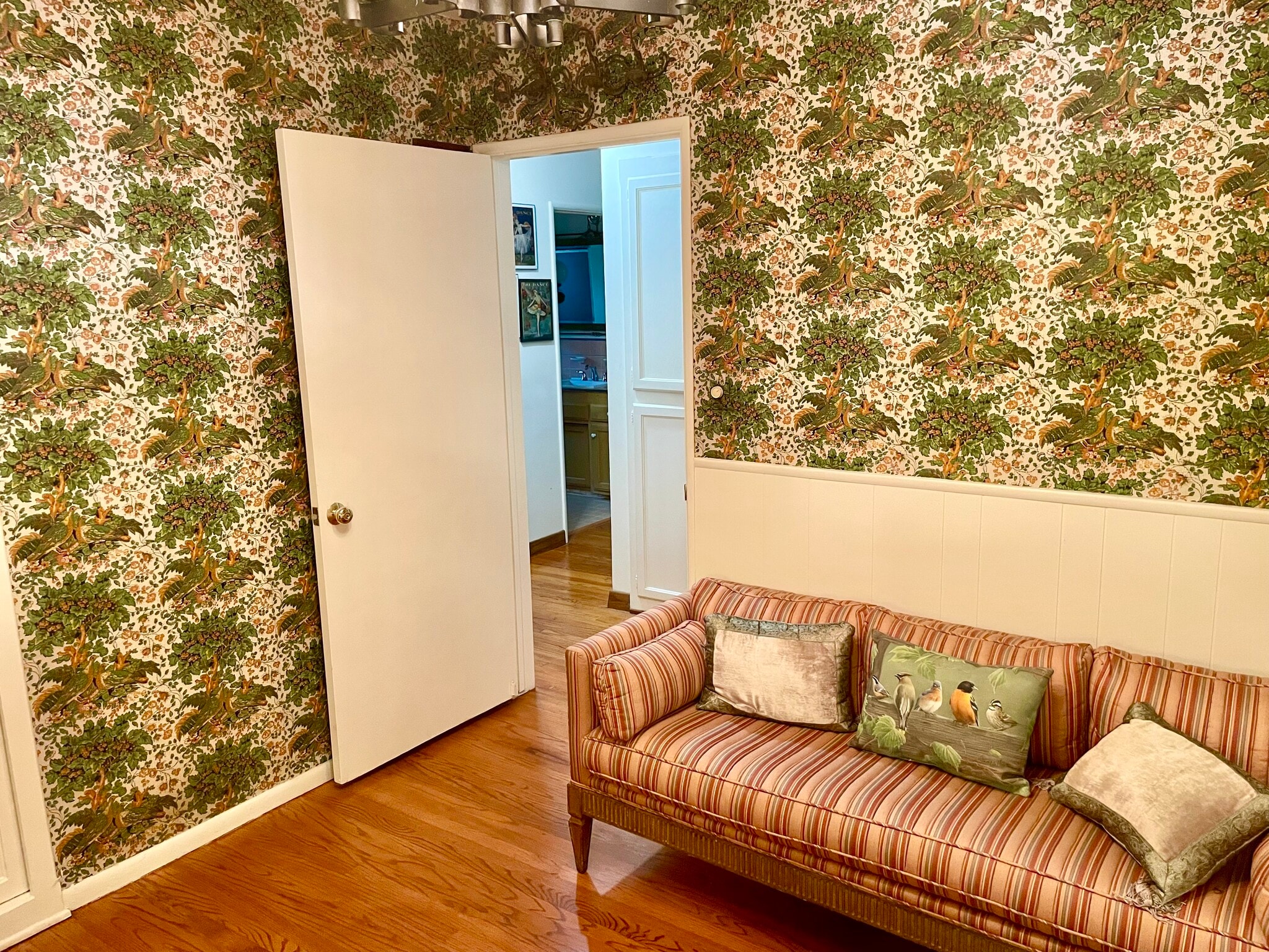Vintage furniture and wallpaper accent the office of this mid century home - 11449 Woodbine St