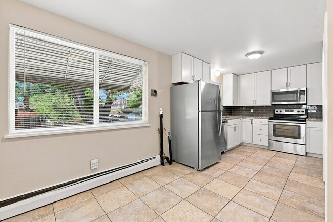 Building Photo - AVAILABLE NOW  Spacious 4-Bedroom Wheat Ridge Home with Finished Garden Level, Two-Car Garage & B...