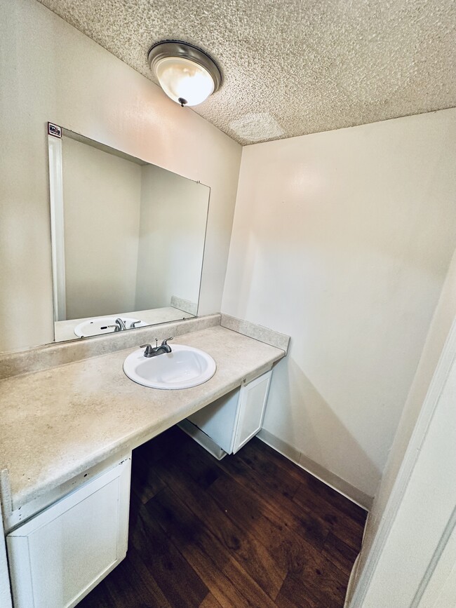 Experience the simplicity and elegance of this modern bathroom design. - Hawk Point Apartments