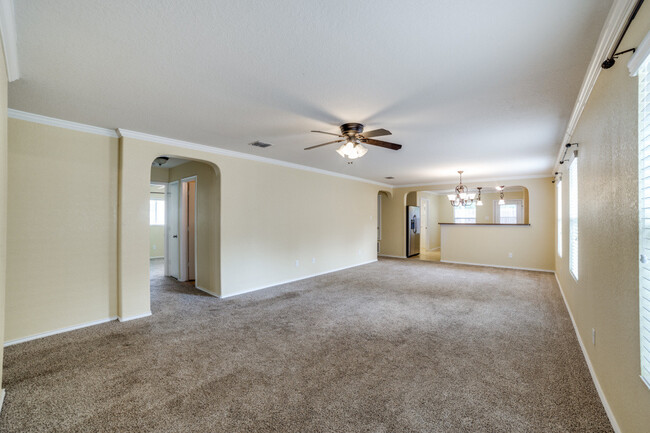 Living room with view to hallway & kitchen/laundry - 27322 Wrought Iron