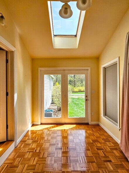 Sun room off living room with parquet floor and skylight - 30 Fairfield Ave