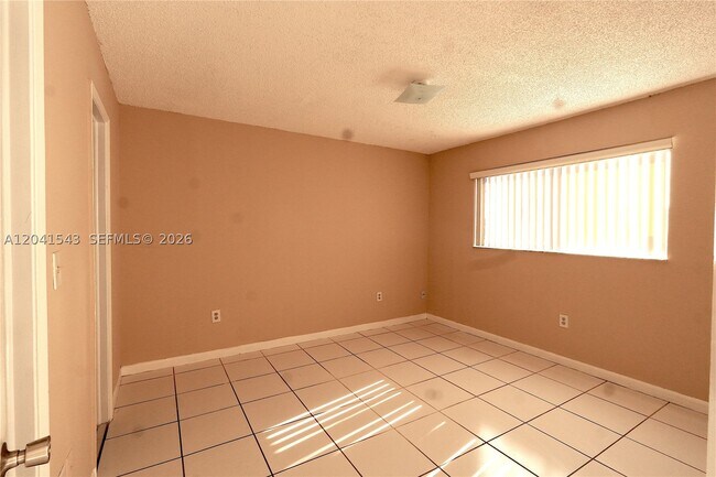 Building Photo - 9915 W Okeechobee Rd