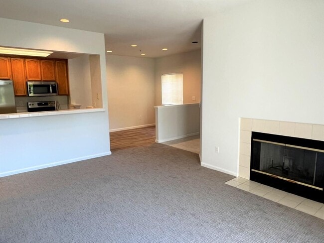Building Photo - Spacious 2BR/2BA Redwood Shores Condo with Balcony, Natural Light & Garage Parking
