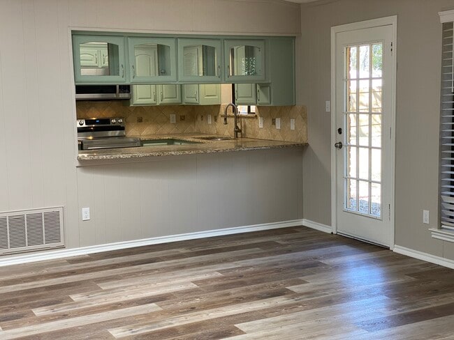 View of kitchen from living room. - 605 Scenic Dr