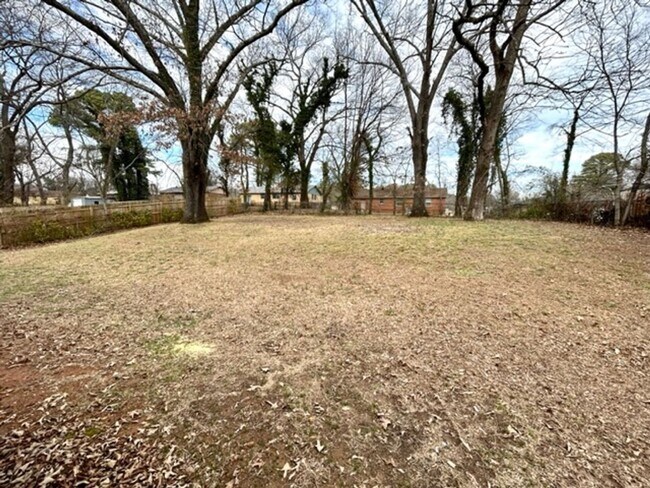 Building Photo - FOUR BEDROOM ONE AND HALF BATH BRICK RANCH HOME