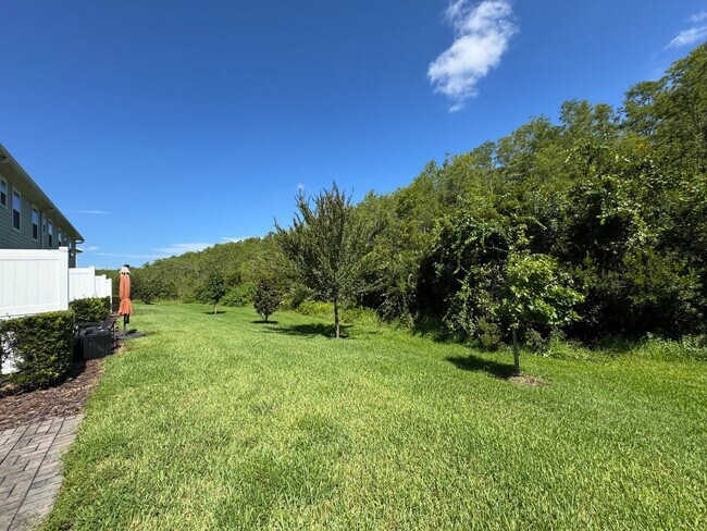 Building Photo - Beautiful End Unit Townhome Near Lake Nona w/ 2-Car Garage & Conservation Views!