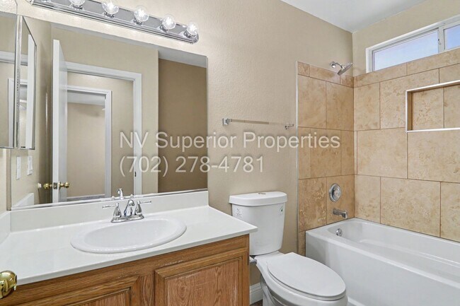Building Photo - NW!! 4 bedrooms!! Bed & Bath DownStairs!!! RV Parking!!! Synthetic Grass Front yard!! Real Grass ...