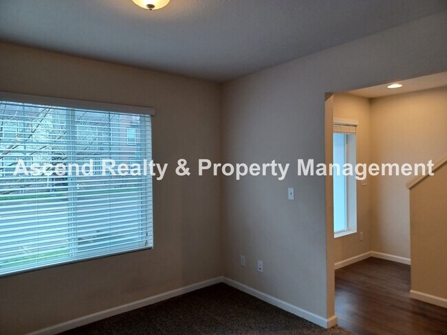 Building Photo - 3 Level End Unit Townhome with Newer Carpet, Open Floor Plan, 2 Balconies, 2 Car Attached Garage ...