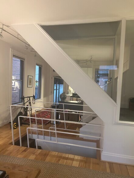 Living room into kitchen - 181 E Kossuth St