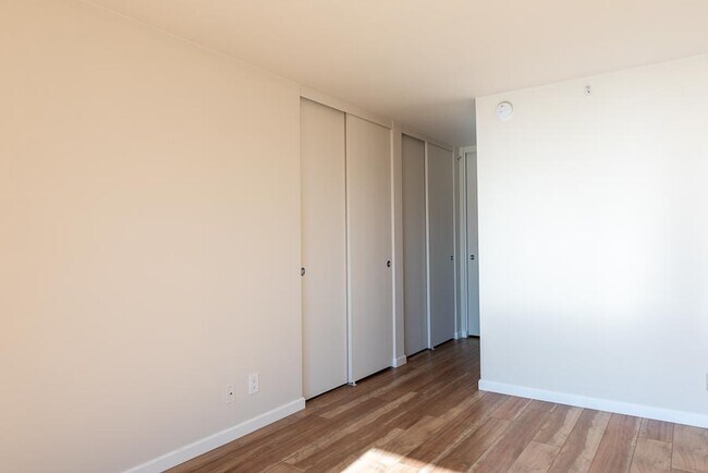Another view of Bedroom 1 showing three of the four double closets - 500 N St