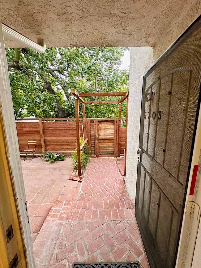 Walkway entry from front door of home perspective. - 5303 Alhama Dr