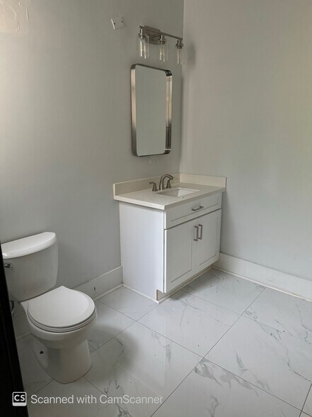 bathroom toilet and sink - 634 N 7th St