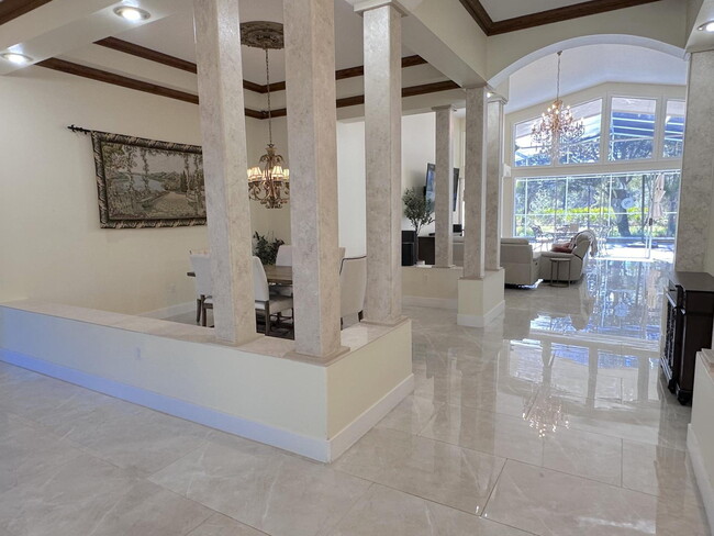 Building Photo - Stunning 5-Bedroom Pool Home in Gated Spyg...