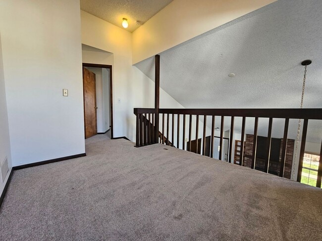 Building Photo - End Unit Condo with Private Patio